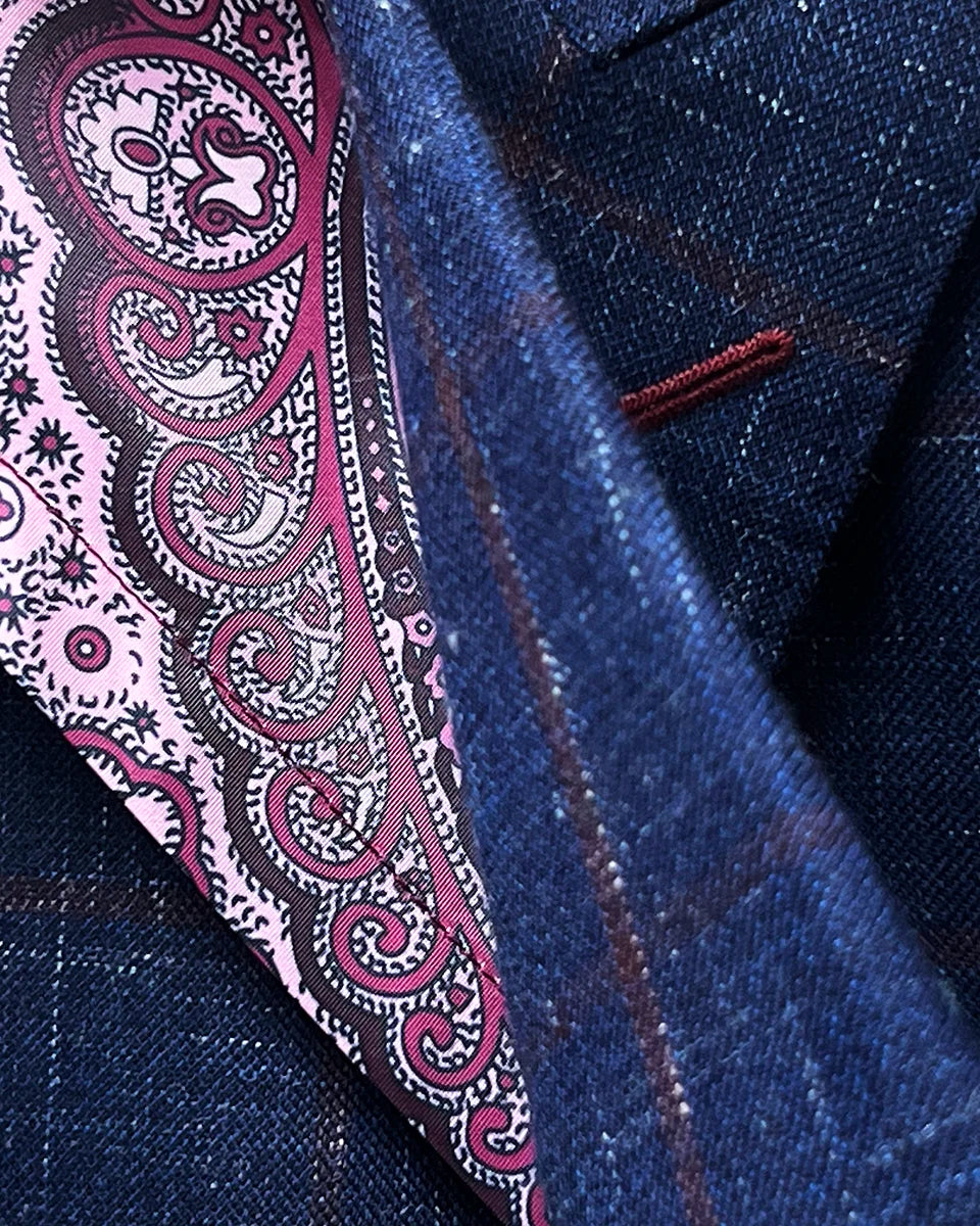 Interior view highlighting flash lining details and color coordination options within navy windowpane sport coat construction