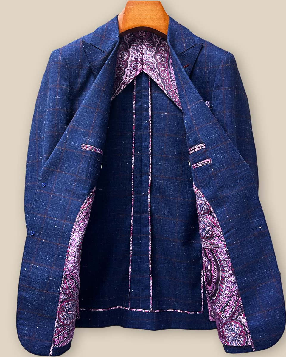 Full interior view of navy windowpane sport coat displaying half-lining design, construction details, and premium fabric backing with soft shoulder structure