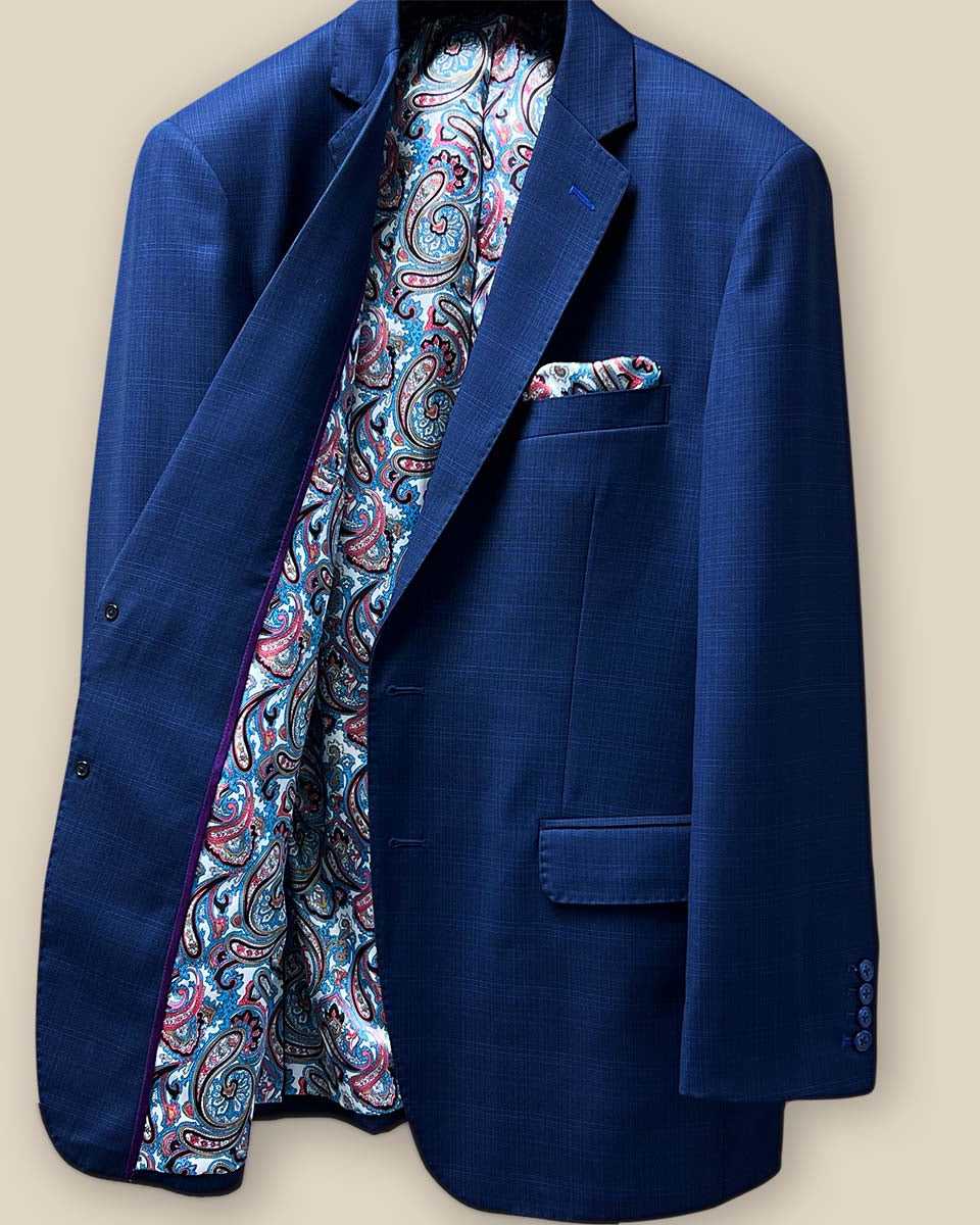 Inside right view of the royal blue suit jacket featuring additional pockets and the fancy paisley lining.