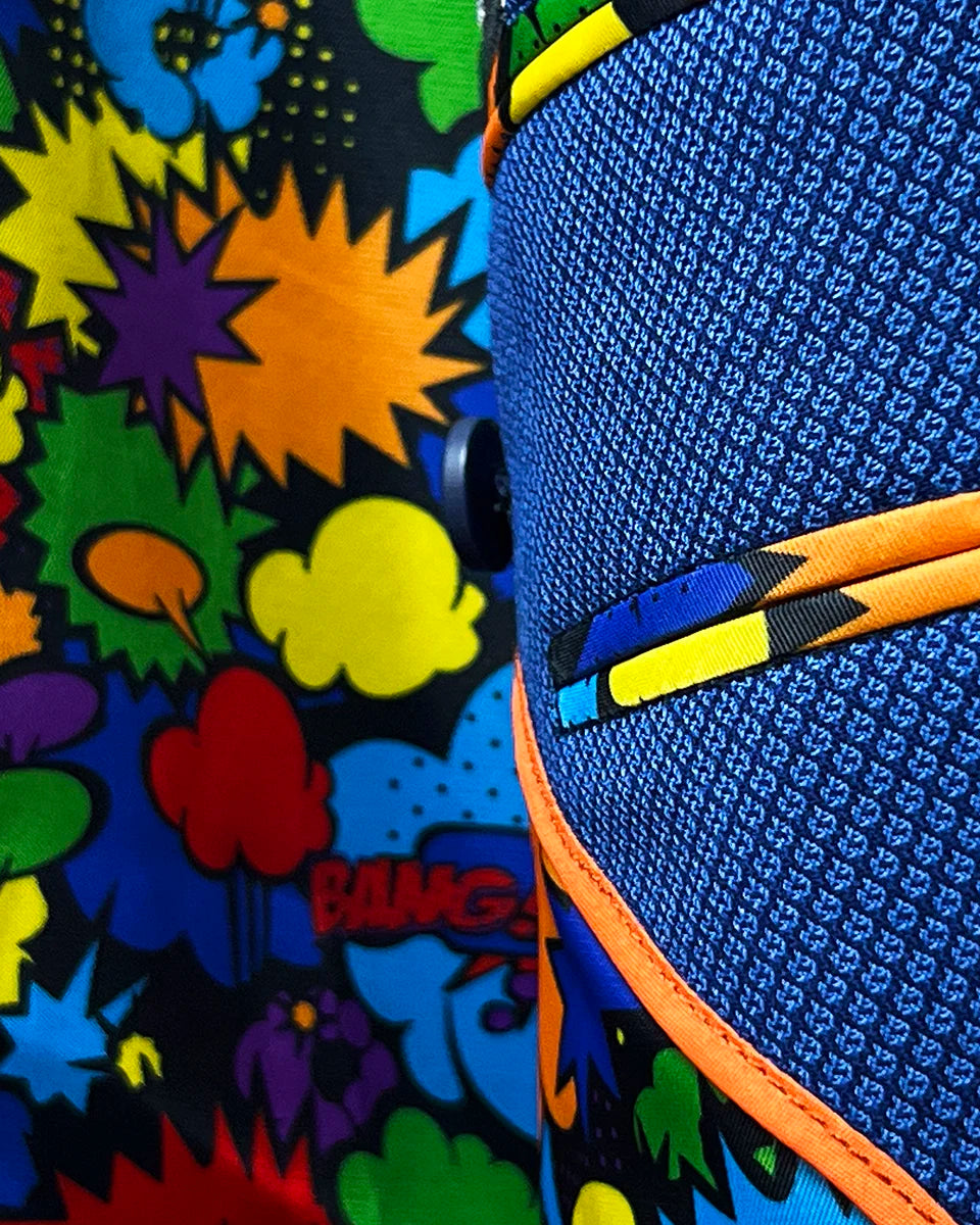 Inside view of the men's sapphire blue suit showing the colorful comics fancy lining with expressions like "wham!" and "pow!", bringing a playful element to the sophisticated attire.