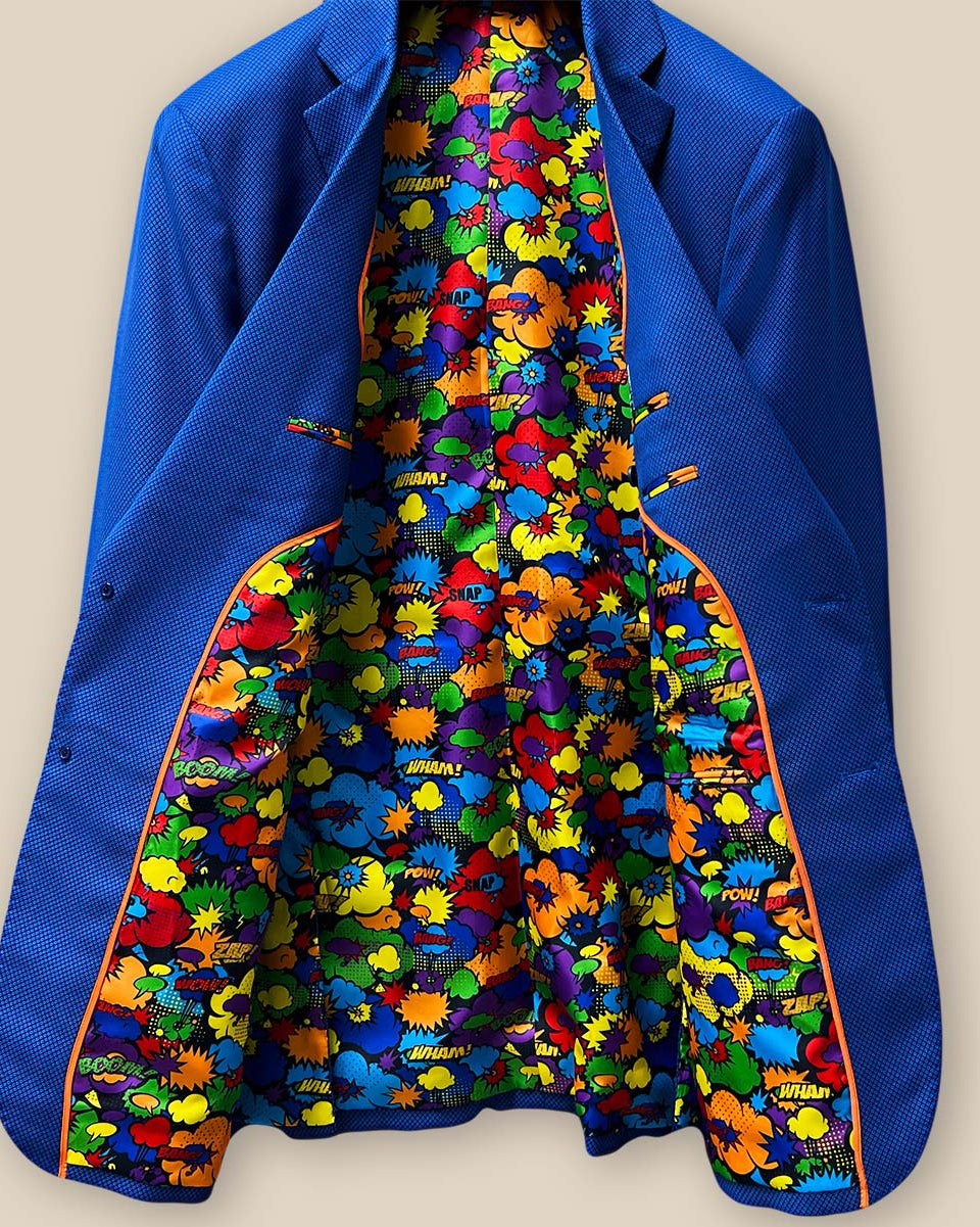 Overall inside view of the sapphire blue men's suit, displaying the comprehensive design and playful comic print lining.