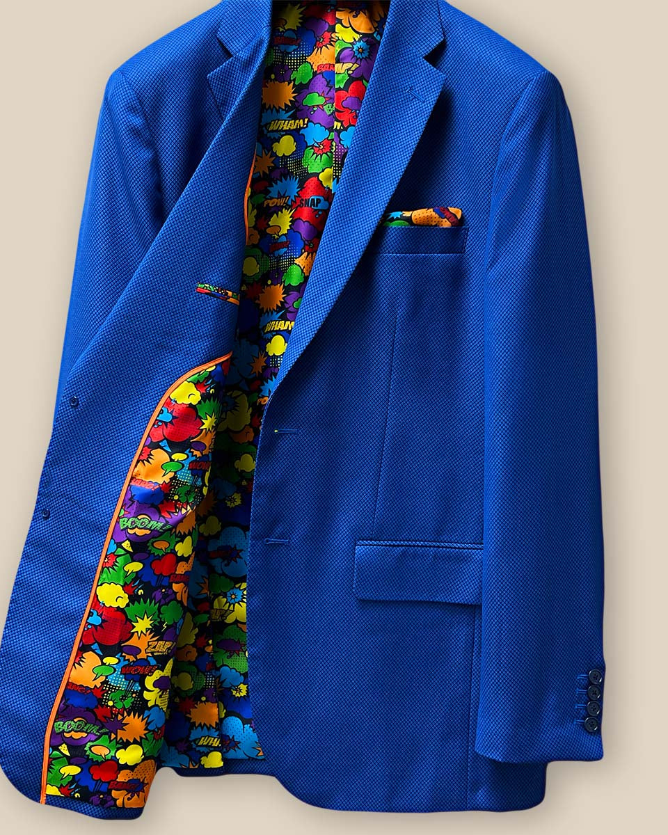 Inside view of the right side of the sapphire blue men's suit, showing the intricate details and vibrant lining.