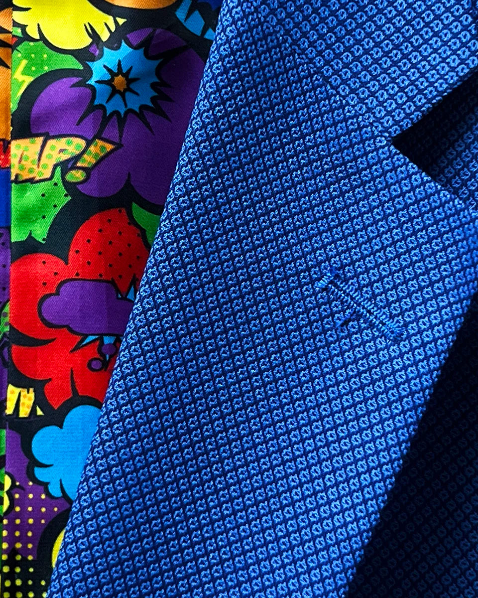 Detailed shot of the notch lapel style on the sapphire blue Westwood Hart men's suit, exemplifying classic tailoring.