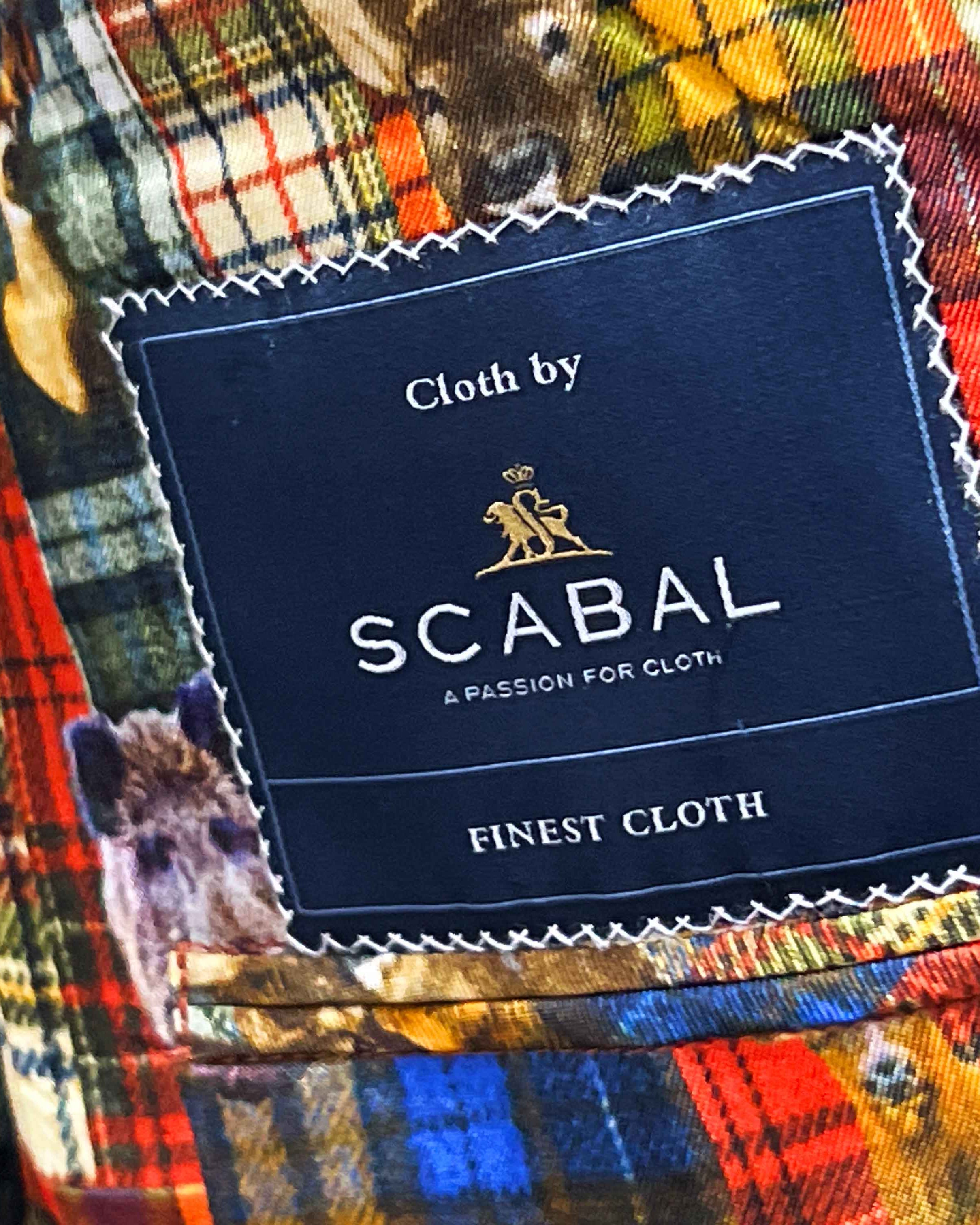 Full ensemble shot of Scabal deep blue navy emerald green overcheck mens suit with styling accessories