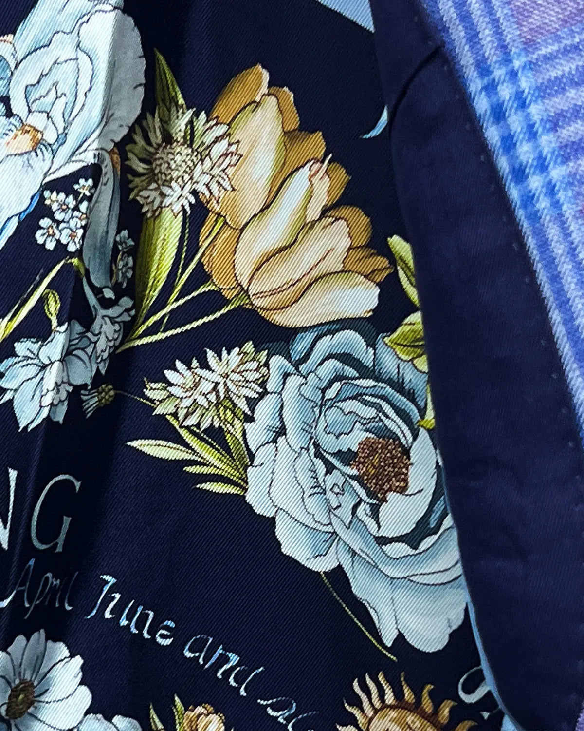 Lining detail of lilac mauve with cornflower blue Glen plaid men's sport coat showing the floral interior lining