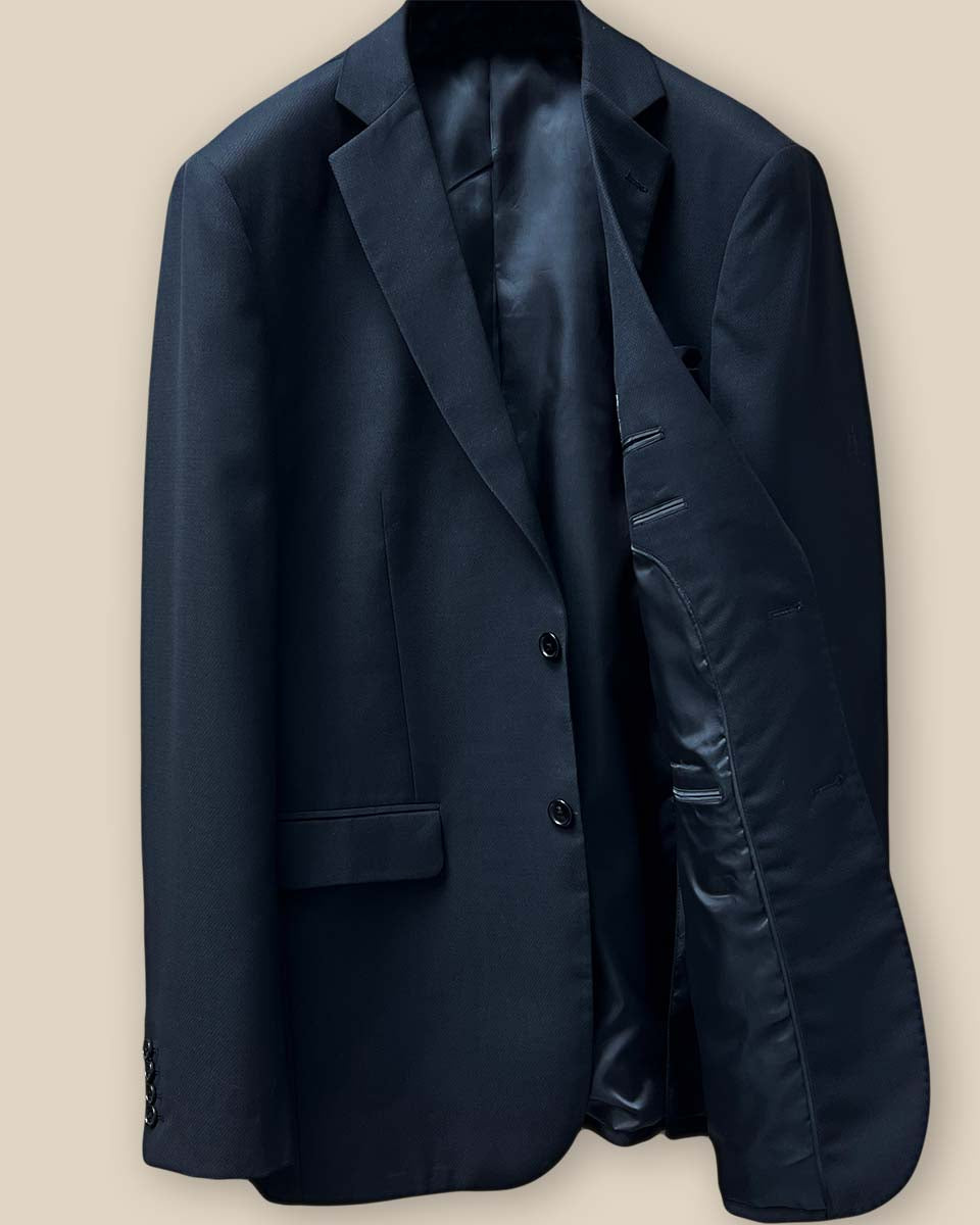 Interior view of the left side of a black Westwood Hart suit jacket, showcasing the black Bemberg silk lining