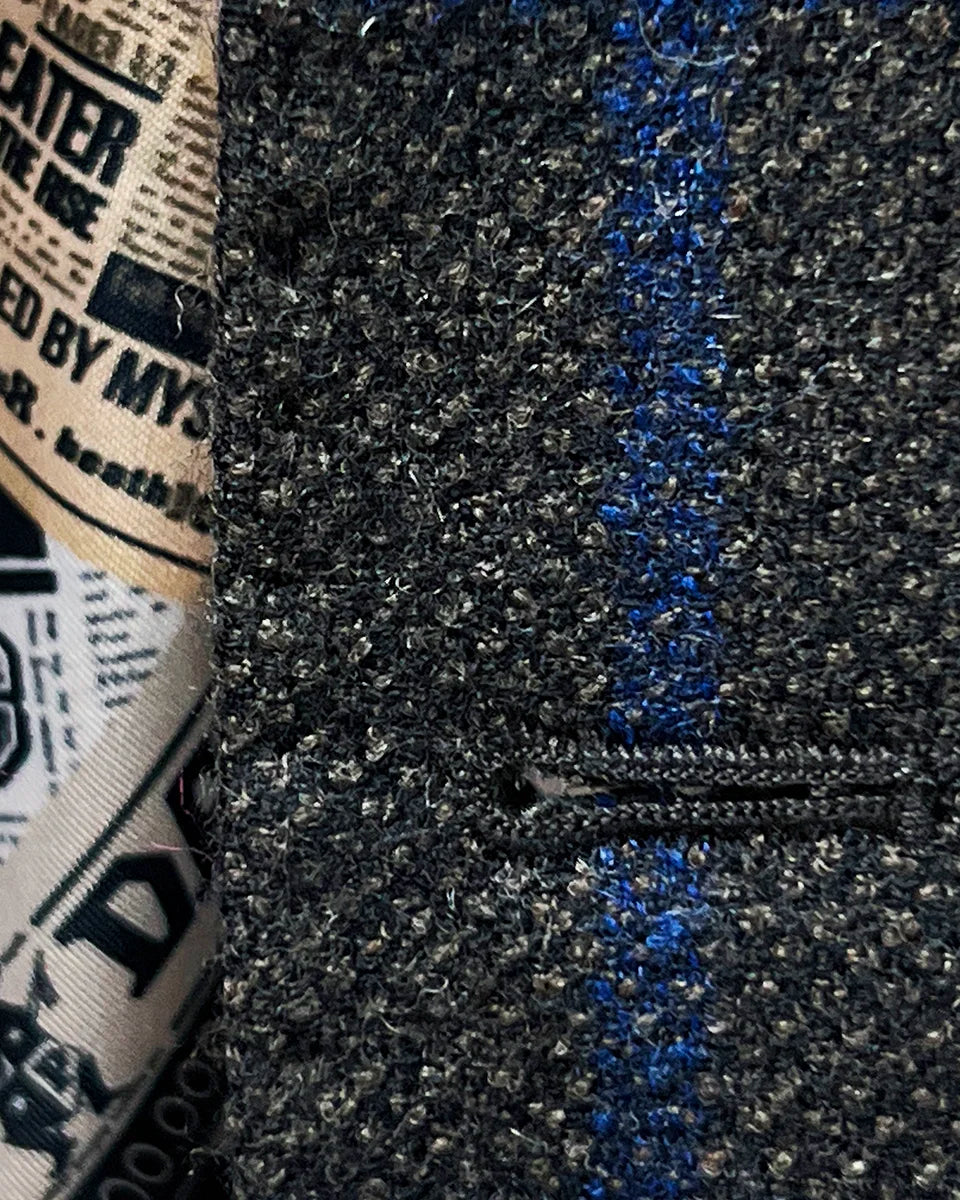 Detailed view of the matching pick stitching on the buttonholes of the Westwood Hart sportcoat.