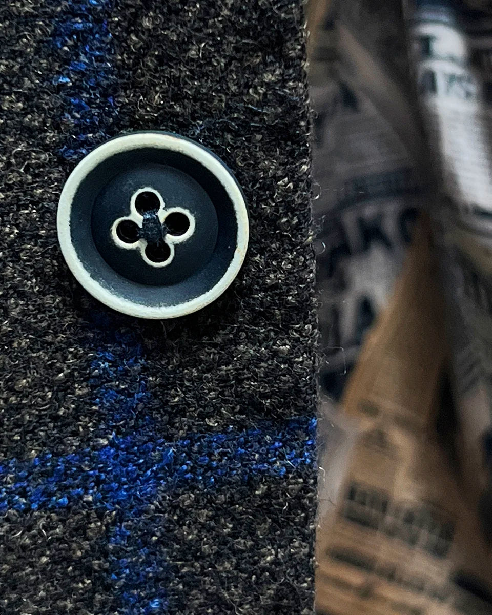 Detailed view of the navy horn buttons with white trimming on the Westwood Hart brown with royal blue windowpane sportcoat.