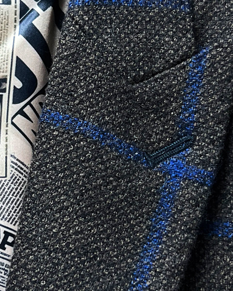 Peak lapel detail on the Westwood Hart brown with royal blue windowpane sportcoat.