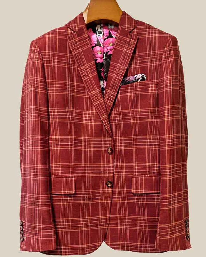 Front button panel of burgundy plaid sport coat featuring burgundy marble buttons and hand pick stitching