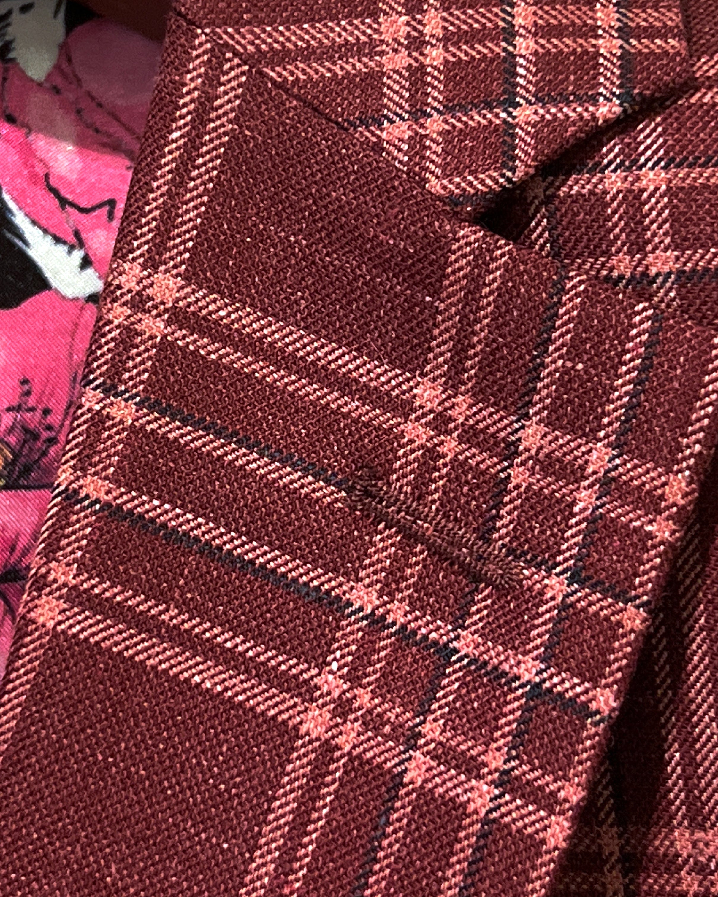 Classic notch lapel detail on burgundy plaid sport coat showing hand pick stitching and plaid check pattern