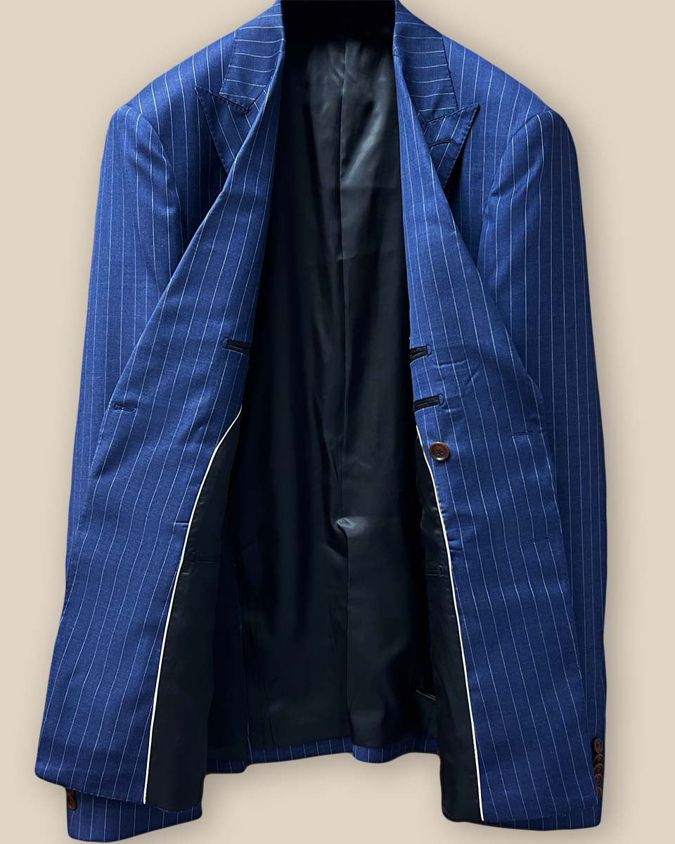 Full view of suit jacket interior, displaying smooth black silk Bemberg lining