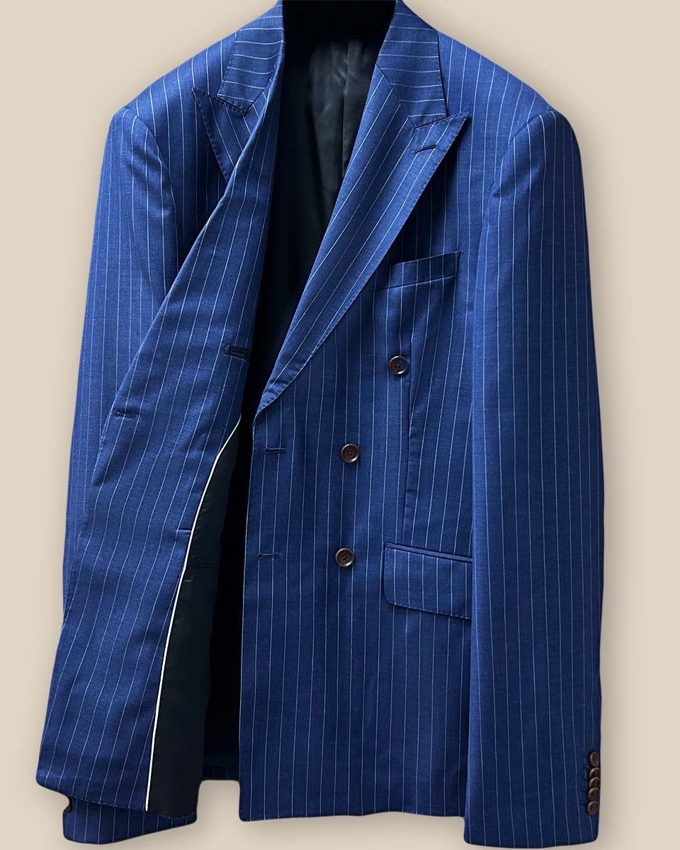 Interior right side of suit jacket, showing lining details and brand label