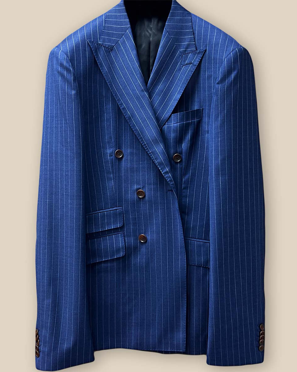 Close-up of jacket front, highlighting brown horn buttons and double-breasted closure