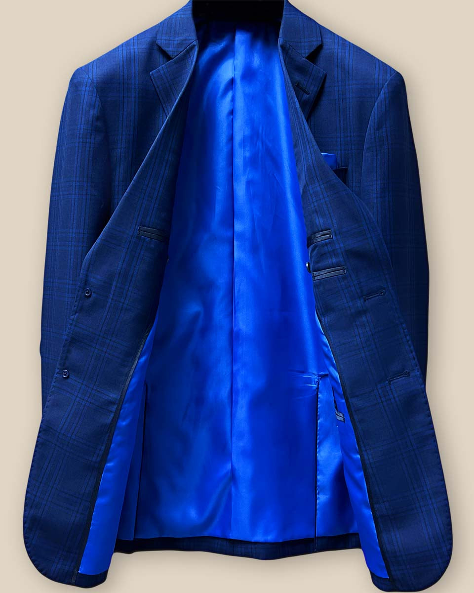 Full interior view of dark blue Westwood Hart suit jacket, displaying luxurious royal blue silk bemberg lining