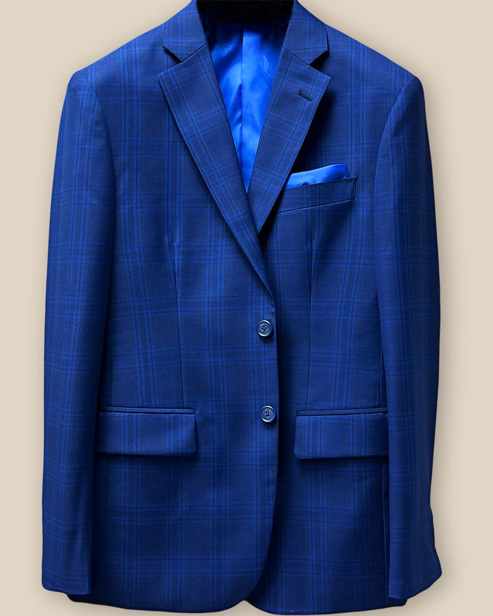 Close-up of navy horn buttons on dark blue Westwood Hart suit jacket with windowpane pattern