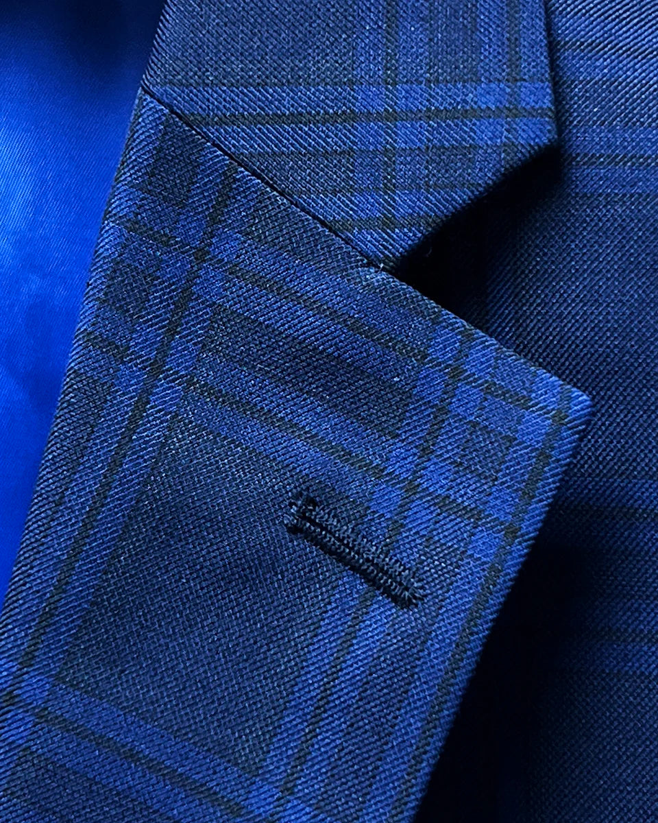 Detail of notch lapel on dark blue Westwood Hart suit jacket with windowpane pattern