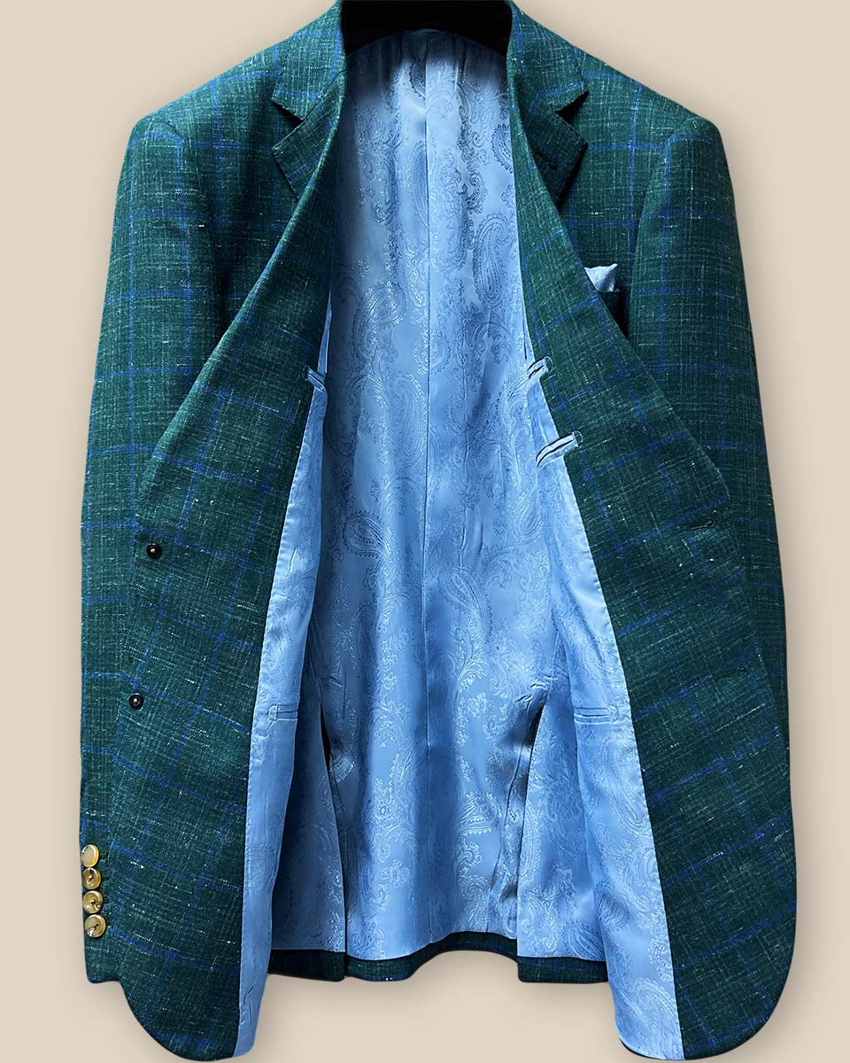 Full view of sky blue paisley lining inside dark green Westwood Hart windowpane sport coat, highlighting the contrast between exterior and interior