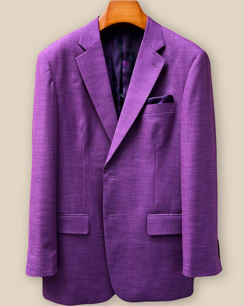 Custom dark orchid purple sport coat displaying elegant lilac contrast buttonholes on the jacket sleeve panel with mulberry horn buttons
