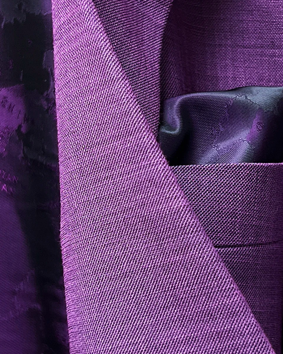 Hand-finished pick stitching detail along lapel edges and seams showcasing traditional tailoring techniques and craftsmanship