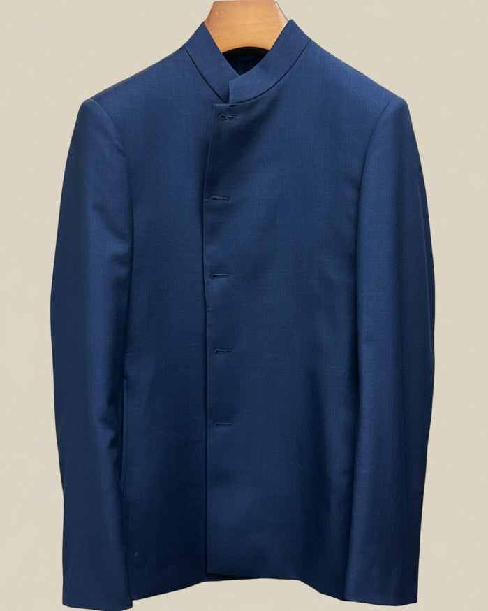 Close-up view of deep blue solid Nehru suit jacket showing marbled dark blue horn buttons with hand-finished stitching detail