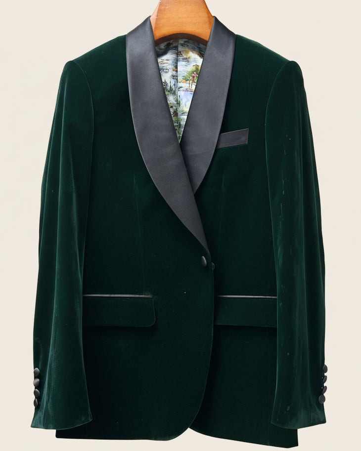 Green velvet tuxedo jacket with gray lapels on a beige background