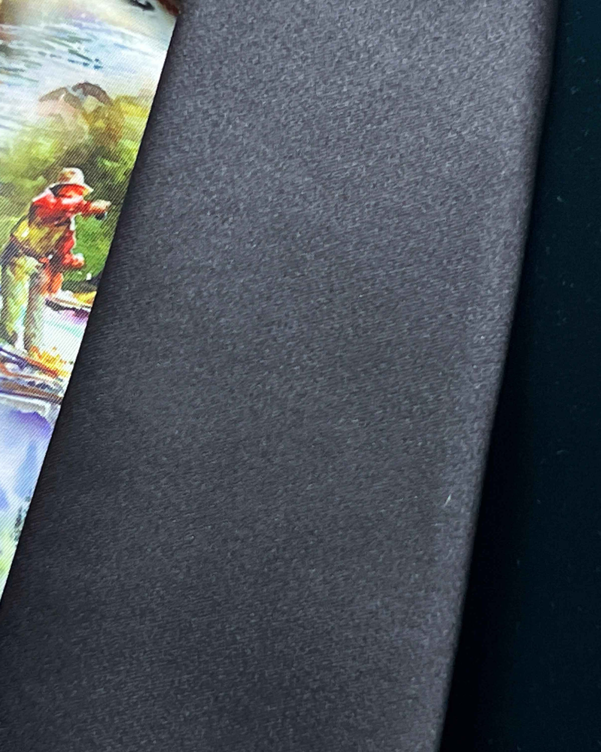 Black tie with a colorful fishing scene on a gray background
