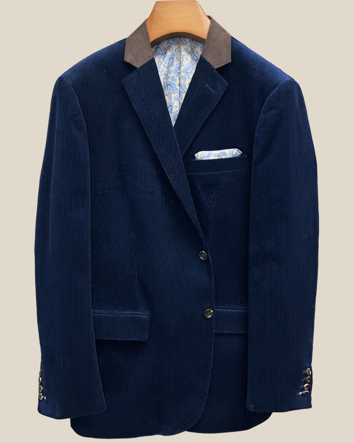 Front button panel of deep navy blue corduroy sport coat featuring tortoiseshell brown horn buttons and hand pick stitching