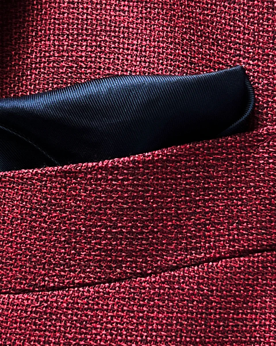 Breast pocket of deep red basketweave sport coat jacket with built-in pocket square holder and hand-finished edges
