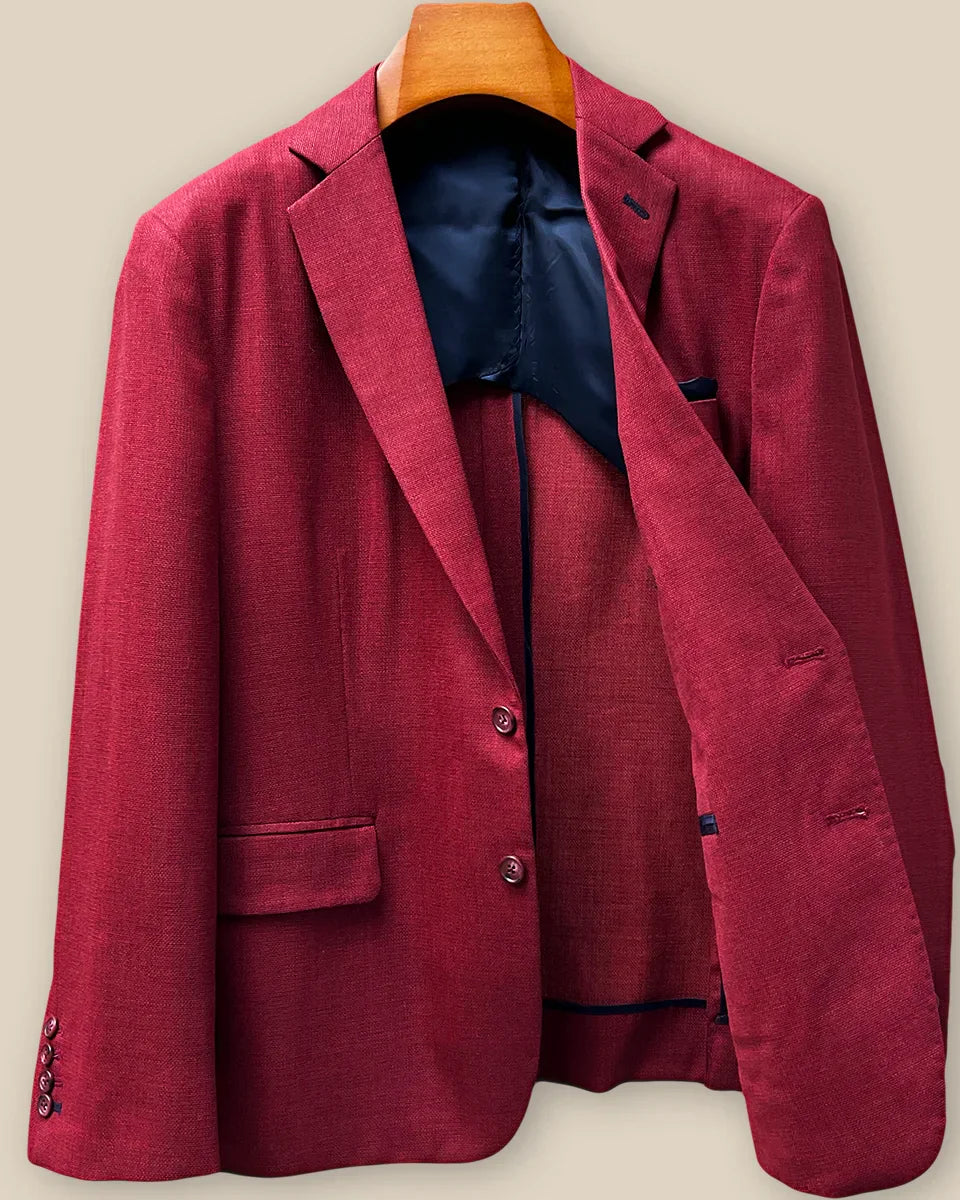 Interior left side of deep red basketweave sport coat jacket displaying navy blue lining with inner pocket