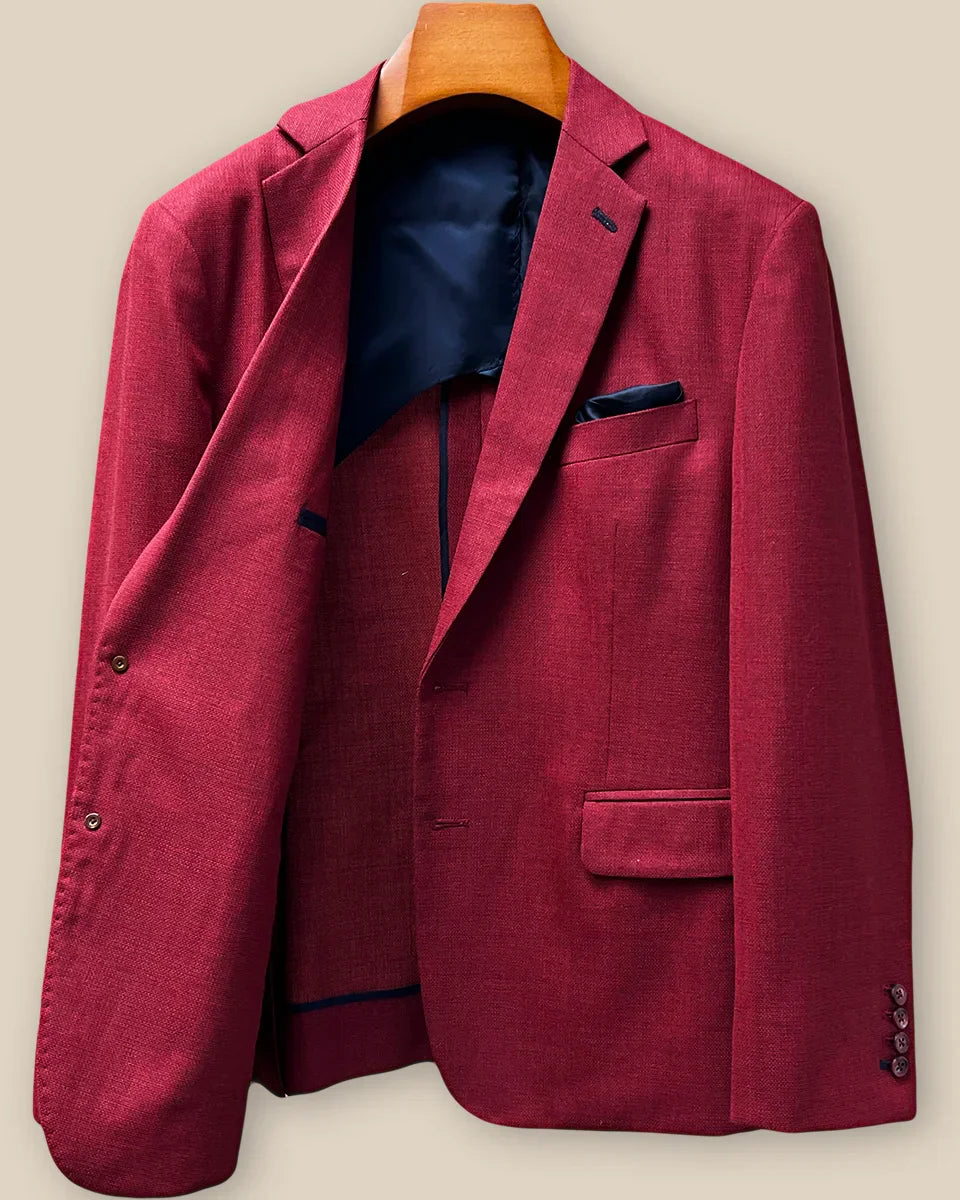 Interior right side of deep red basketweave sport coat jacket revealing navy lining and internal construction details