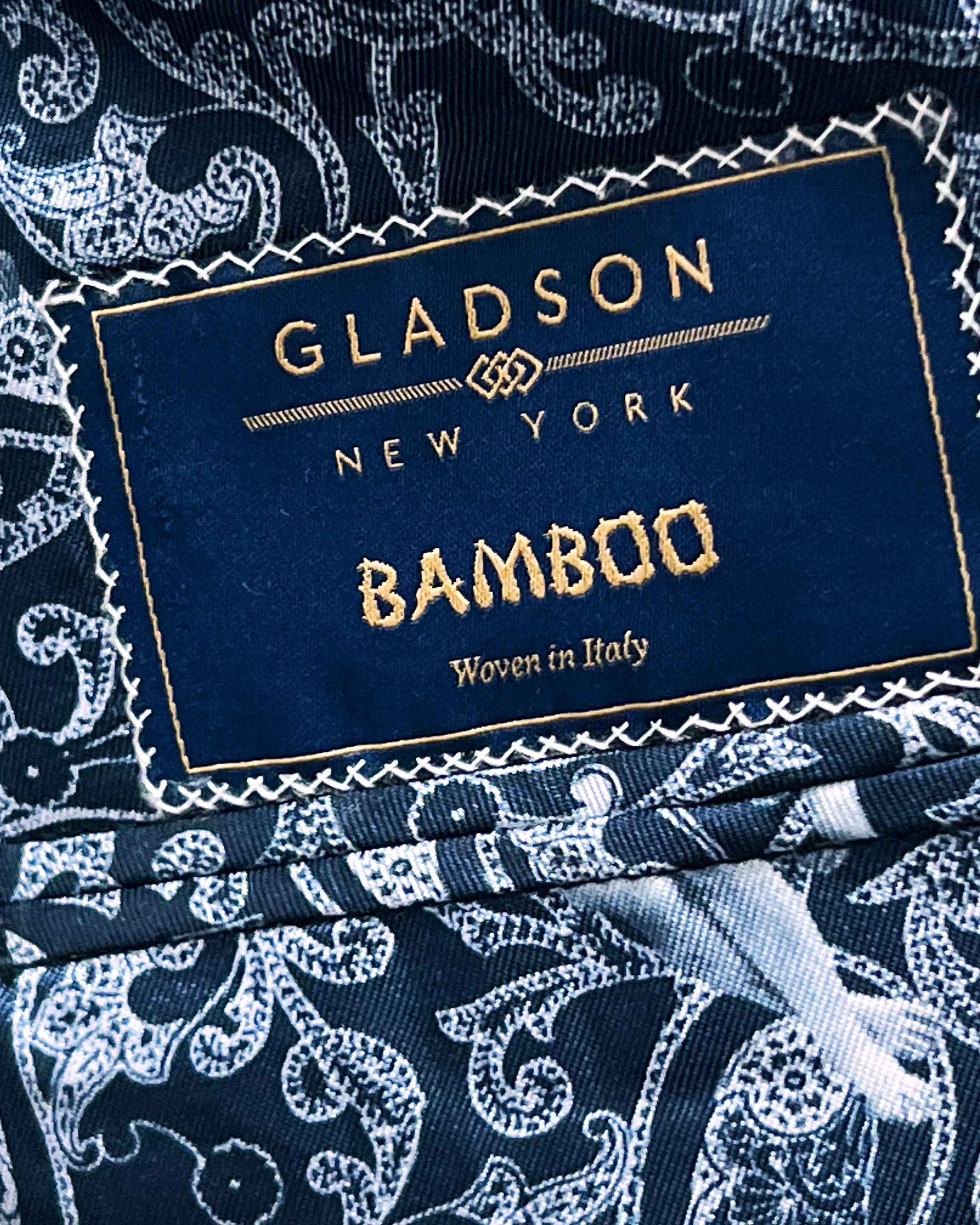 Full front view of deep teal green multi check suit jacket showing notch lapels