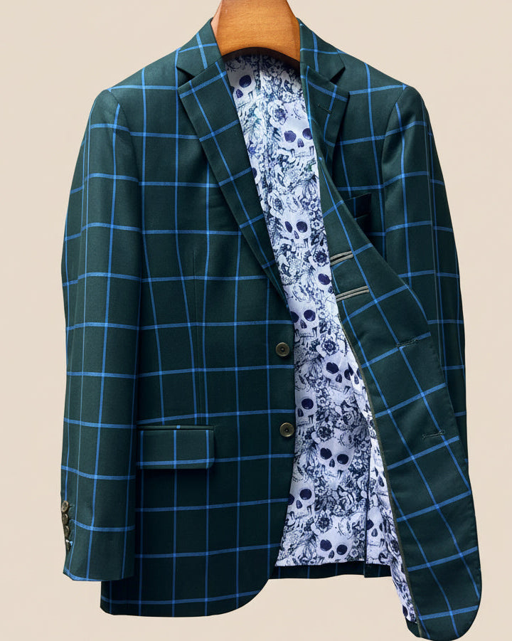 Interior left side of forest green windowpane sport coat displaying white and light blue floral and skull pattern lining with inner pocket