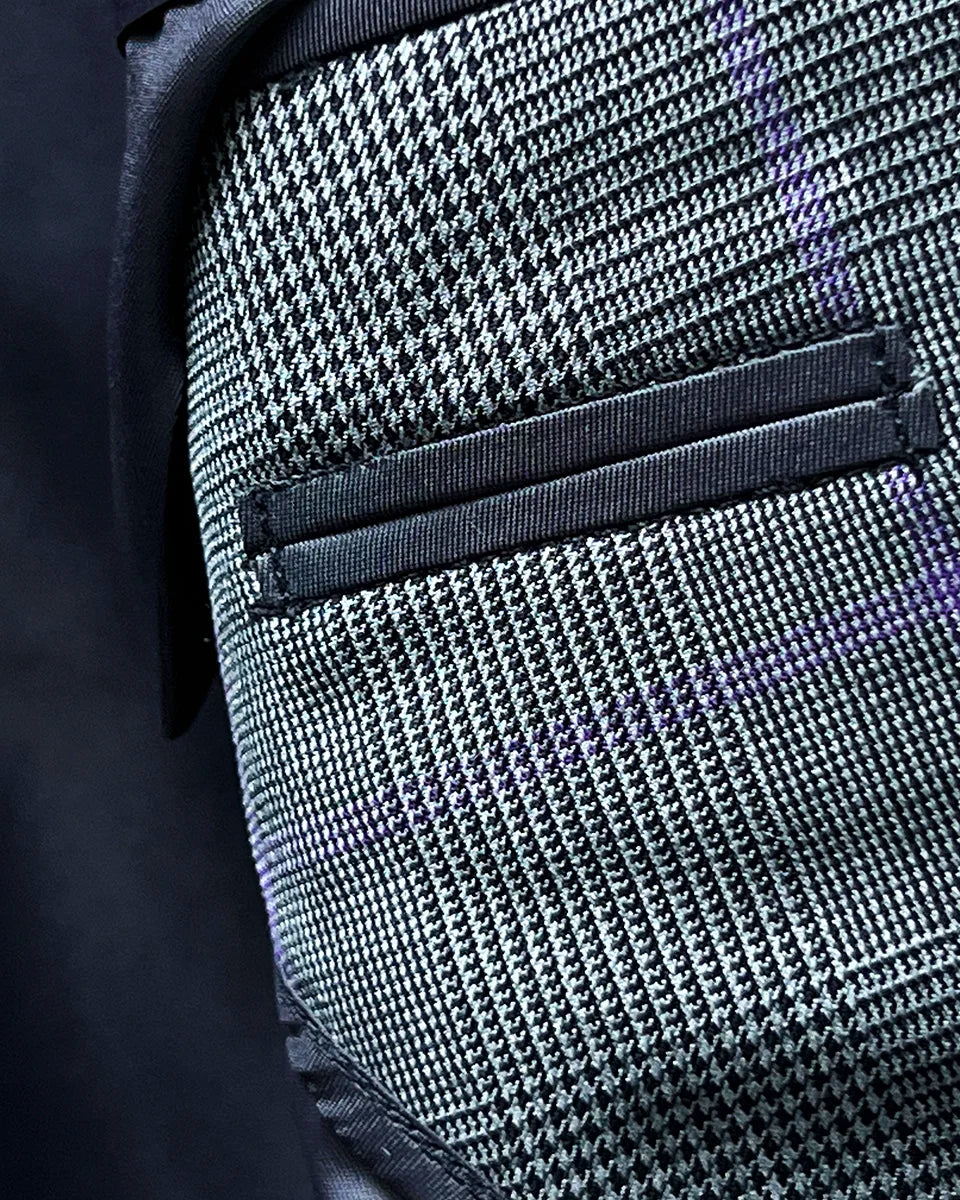 Close-up of smooth grey bemberg lining inside the suit jacket