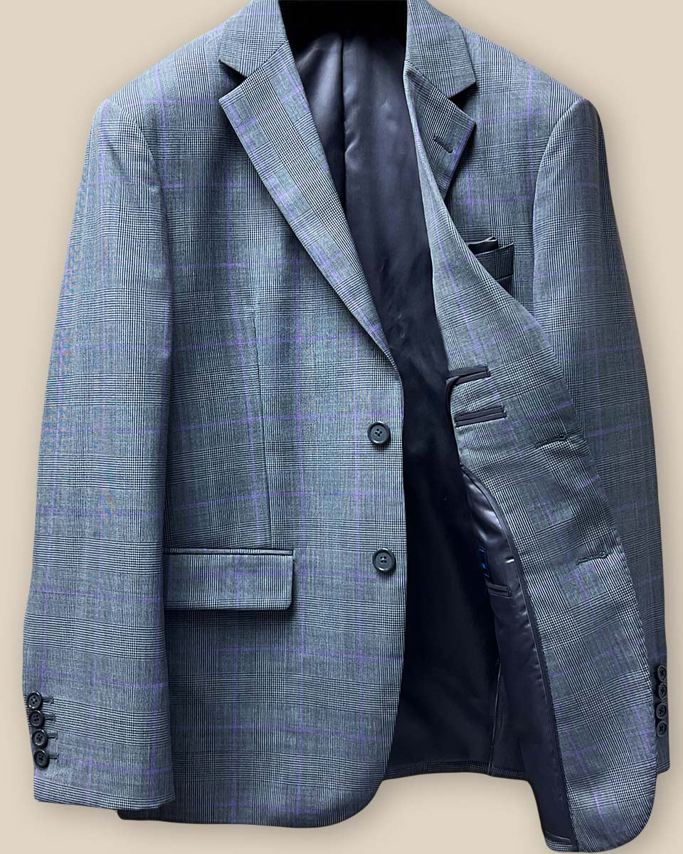 Interior view of grey suit jacket's left side, displaying inner pockets and grey bemberg lining