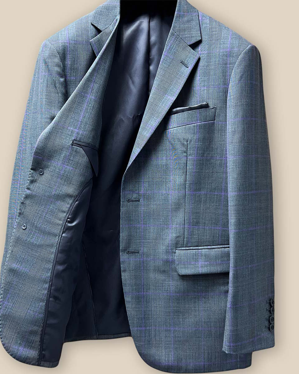 Interior view of grey suit jacket's right side, showing structural elements and lining