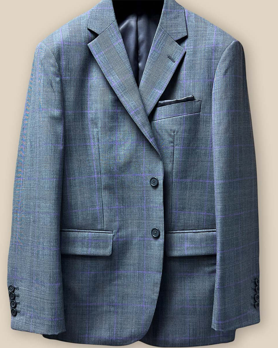 Close-up of suit jacket front, focusing on grey horn buttons and buttonholes