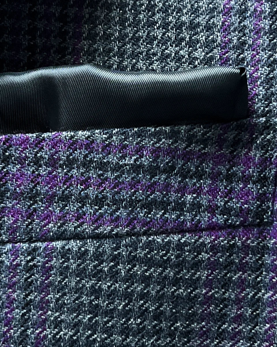 Close-up of built-in pocket square feature in grey and purple plaid fabric