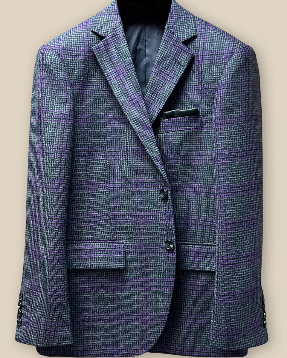 Close-up of grey marble horn buttons on front panel of custom Westwood Hart sport coat