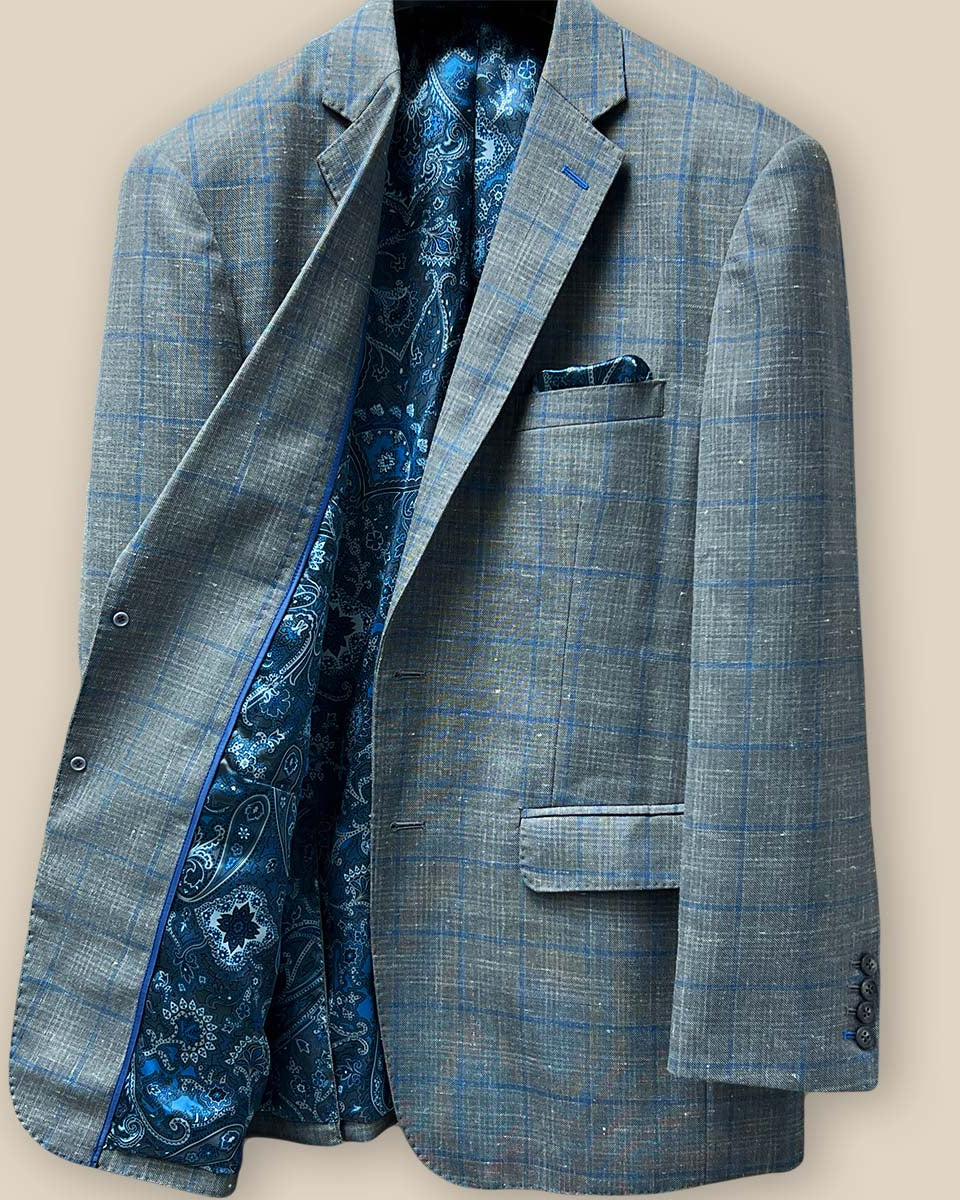 Interior view of the right side of the Westwood Hart grey with medium blue windowpane men's sport coat.