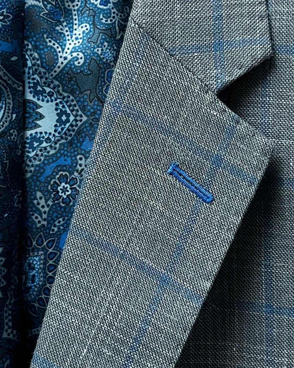 Detail of the notch lapel on the Westwood Hart grey with medium blue windowpane men's sport coat.
