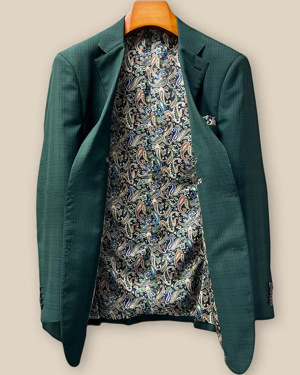 Full interior view of custom sport coat jacket showcasing luxurious paisley lining in navy, rust, green and light blue with Westwood Hart branding