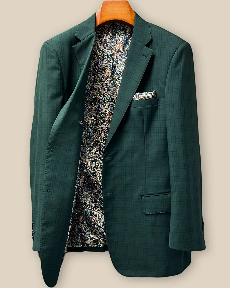 Interior right side of hunter green checkered sport coat jacket revealing paisley lining and internal construction details