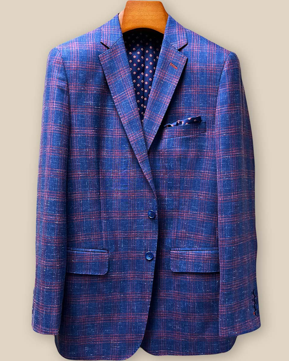 Detailed front button stance showing navy horn buttons against indigo blue windowpane fabric with visible pick stitching along button edges