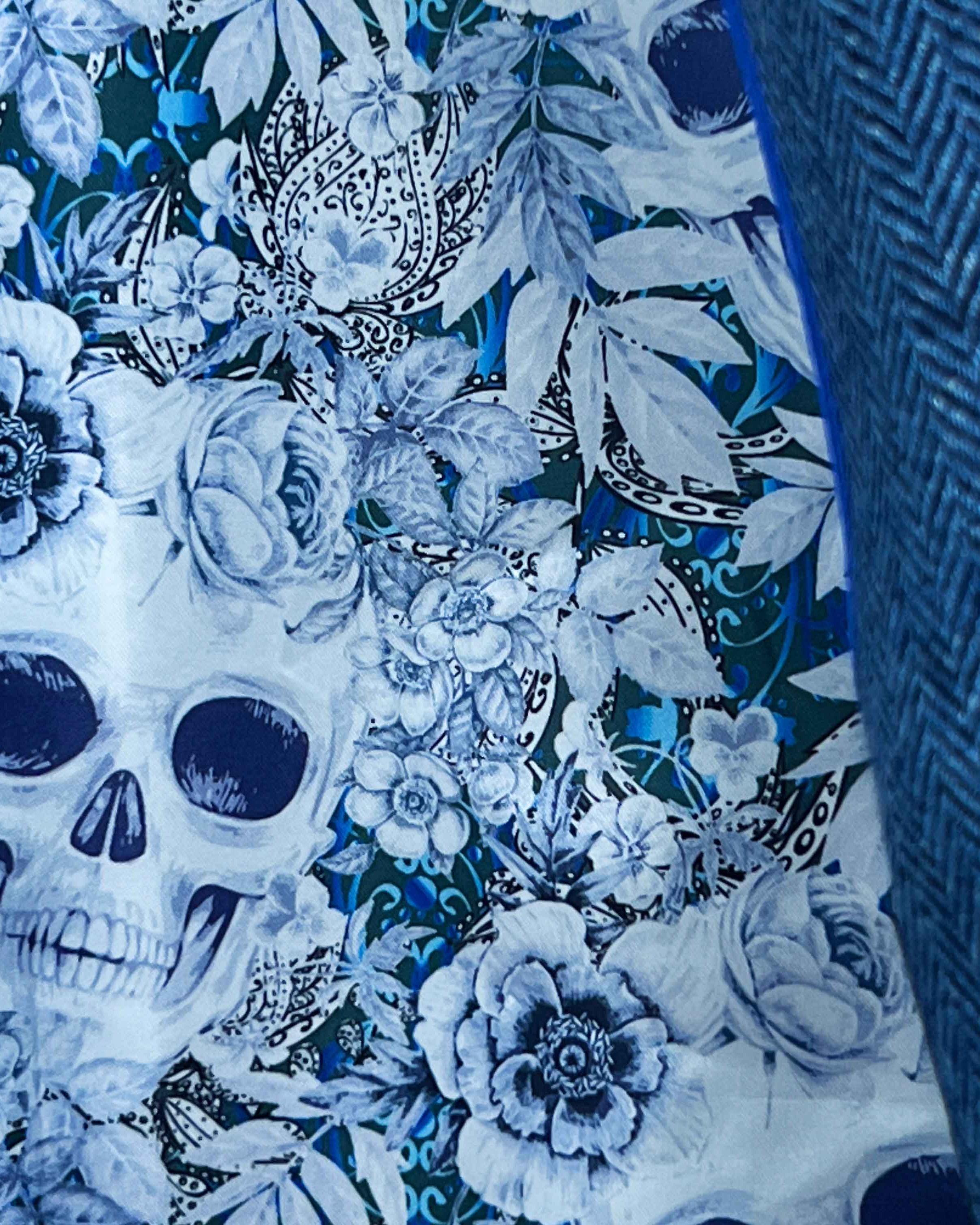 Colorful flash lining detail visible at jacket cuffs and vents in blue and white floral skull pattern