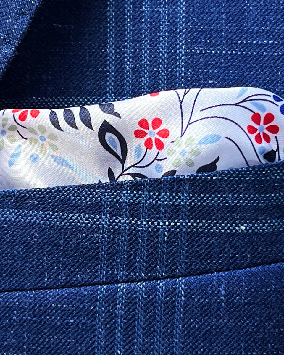 Integrated pocket square detail showing coordinated styling with paisley lining pattern emerging from breast pocket