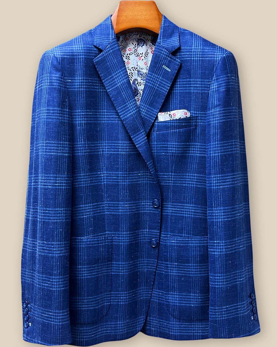 Front button stance displaying navy horn marble buttons against indigo windowpane fabric with visible pick stitching details