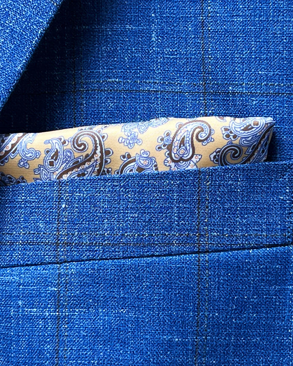 Integrated pocket square detail showing coordinated fabric placement within breast pocket of windowpane sport coat
