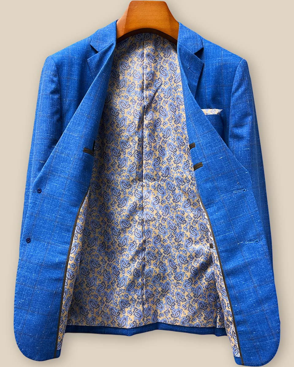 Full interior lining showcase featuring luxurious brown paisley pattern with blue details throughout jacket interior