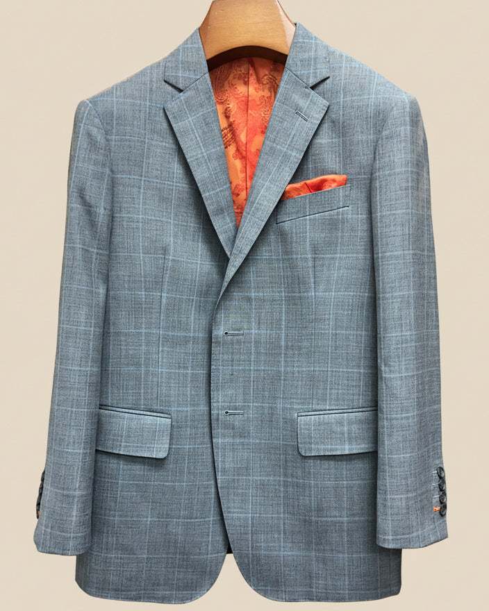 Close-up view of light gray with light blue windowpane sport coat showing contrast bright orange accent buttonhole with hand-finished stitching detail